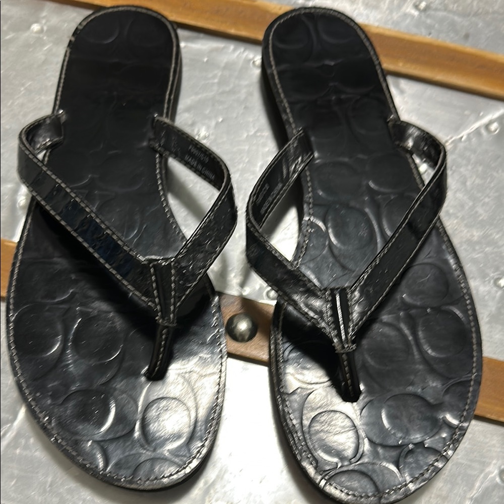 Embossed Black Flip Flops